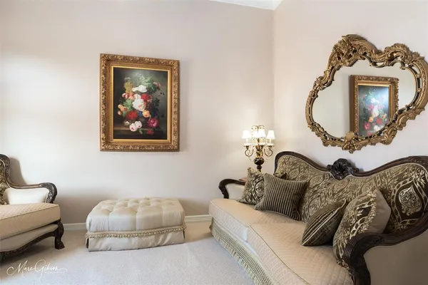 a living room with furniture a couch and a mirror