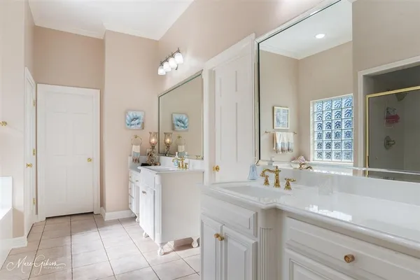 a bathroom with a sink double vanity and a mirror