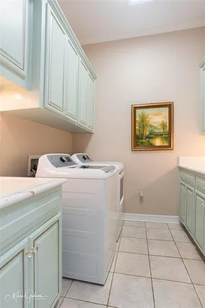 a utility room with washer and dryer