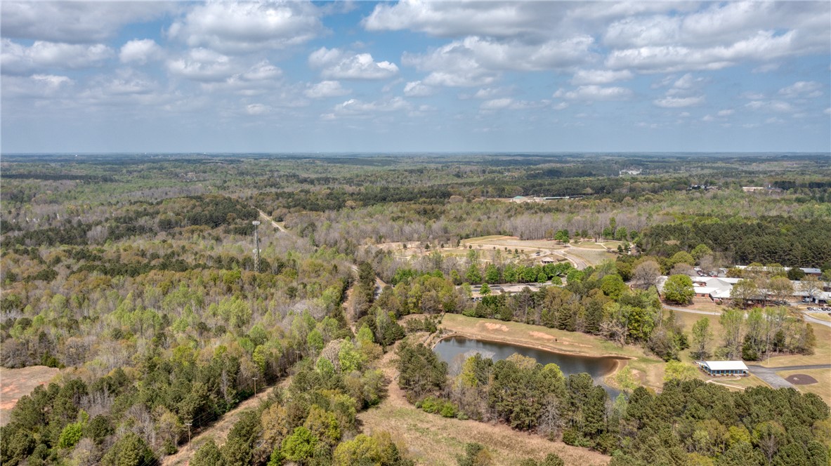 102 Hawk Ridge Drive Anderson, SC 29621 - Photo 31 of 38 Vast natural landscapes with a tranquil pond and scattered community buildings await.
