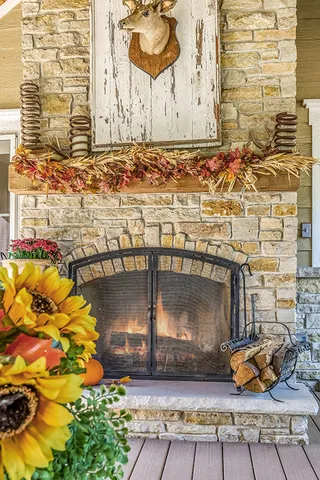 a view of backyard with seating space and wooden floor