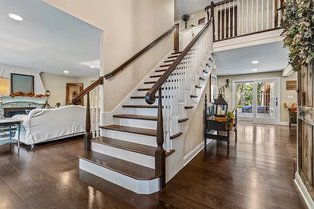 a kitchen with center island table chairs stainless steel appliances and cabinets