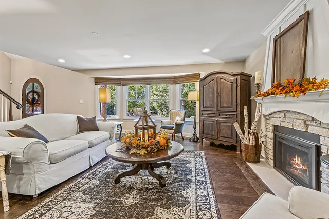 a dining room with furniture a rug and wooden floor