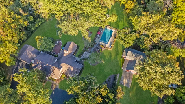 an aerial view of a house with outdoor space and street view