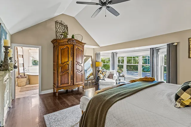 a bedroom with furniture and a window