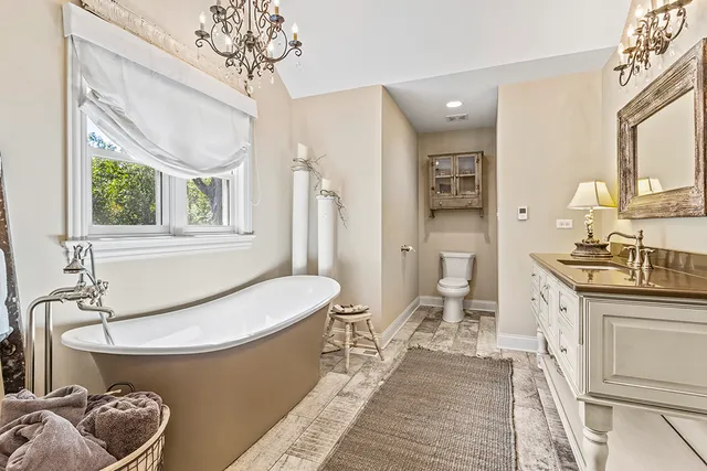 a bathroom with a sink a toilet and tub