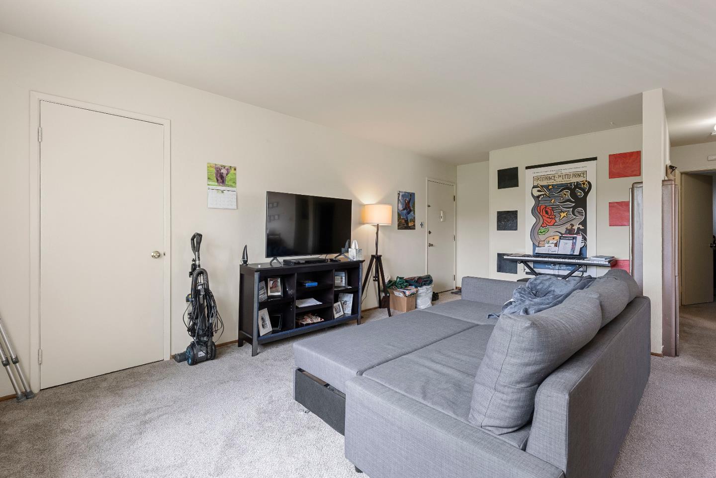 2127 Monroe Street Santa Clara, CA 95050 - Photo 4 of 25 a living room with furniture and a flat screen tv