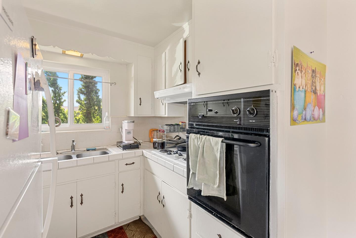 2127 Monroe Street Santa Clara, CA 95050 - Photo 8 of 25 a kitchen with stainless steel appliances granite countertop a sink stove and cabinets