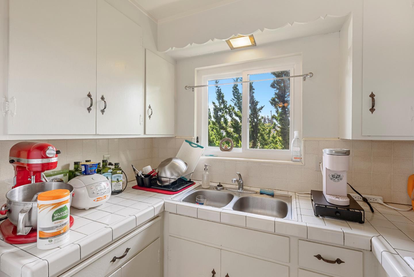 2127 Monroe Street Santa Clara, CA 95050 - Photo 9 of 25 a kitchen with a sink cabinets and window