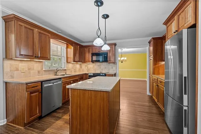 a view of an empty room with a window and a flat screen tv