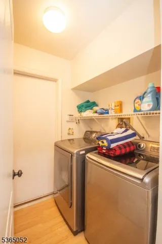 a utility room with washer and dryer