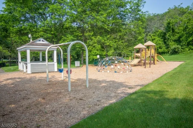 a view of a house with backyard and a garden