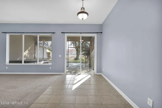 a view of a room with a large window