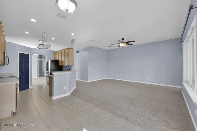 a view of a kitchen with a sink and cabinets