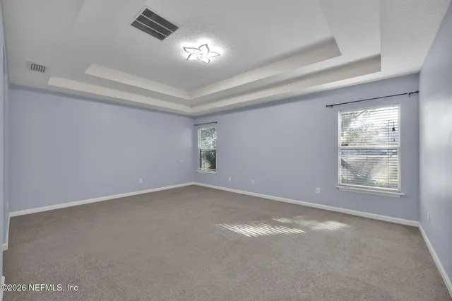 an empty room with windows