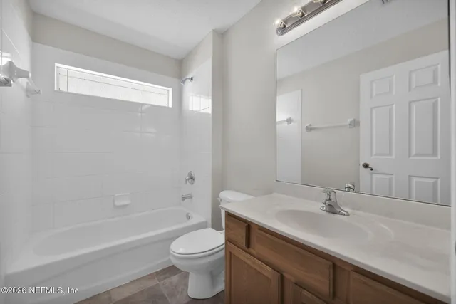 a bathroom with a sink a toilet and a bathtub