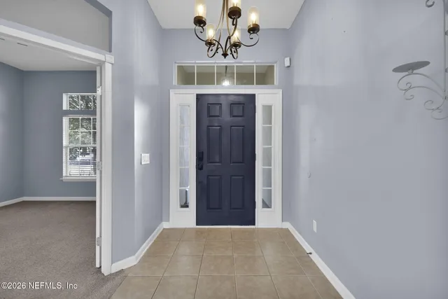 a view of a hallway with a chandelier