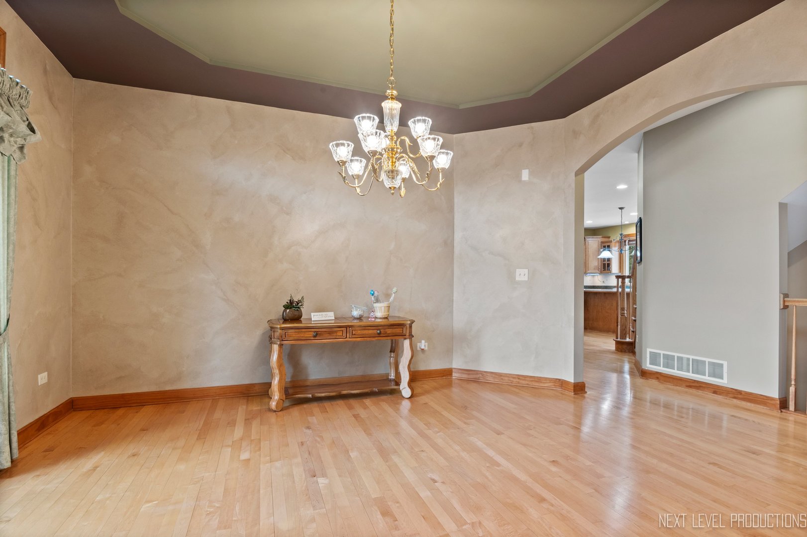 5370 Old Reserve Road Oswego, IL 60543 - Photo 16 of 48 a view of a room with wooden floor and chandelier