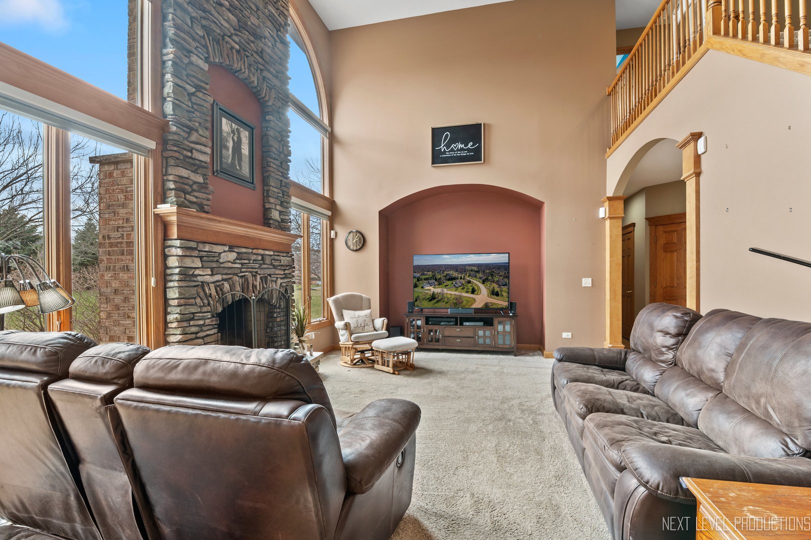 5370 Old Reserve Road Oswego, IL 60543 - Photo 18 of 48 a living room with furniture a fireplace and a large window