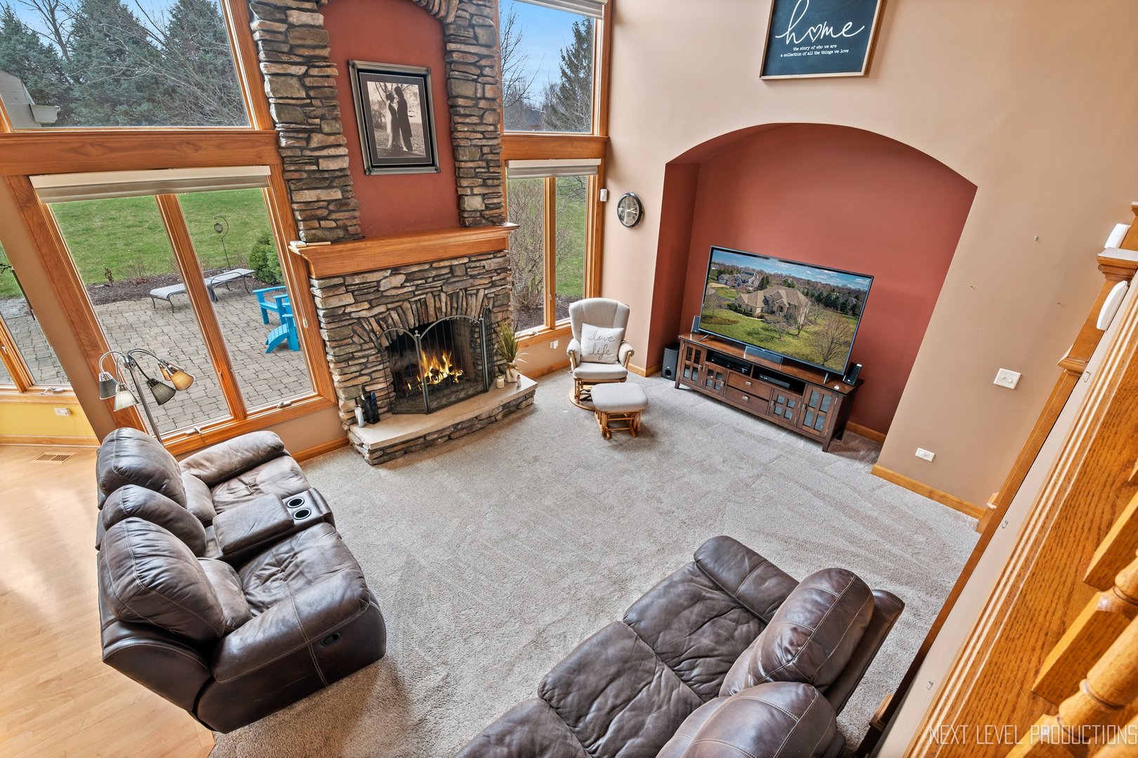 5370 Old Reserve Road Oswego, IL 60543 - Photo 20 of 48 a living room with furniture a flat screen tv and a fireplace