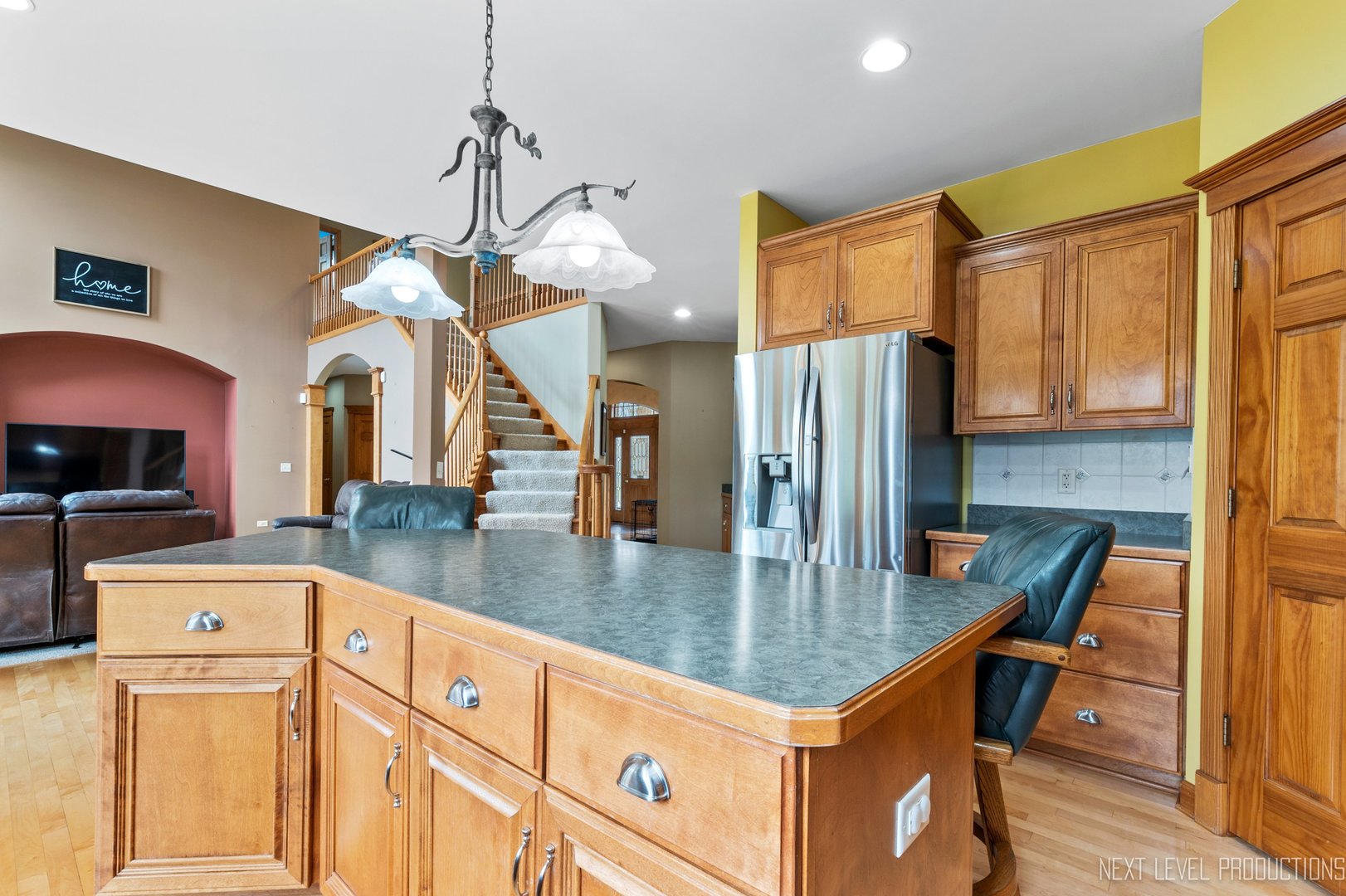 5370 Old Reserve Road Oswego, IL 60543 - Photo 23 of 48 a kitchen with stainless steel appliances granite countertop a refrigerator a stove and a sink with granite countertops