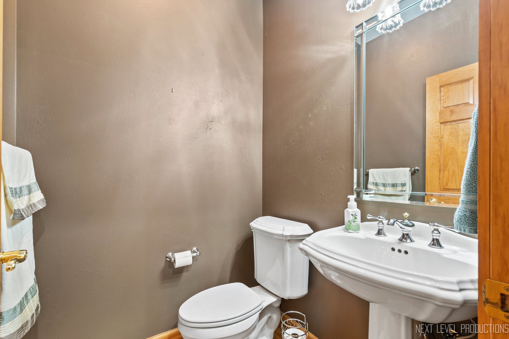 5370 Old Reserve Road Oswego, IL 60543 - Photo 28 of 48 a white toilet sitting next to a bathroom sink