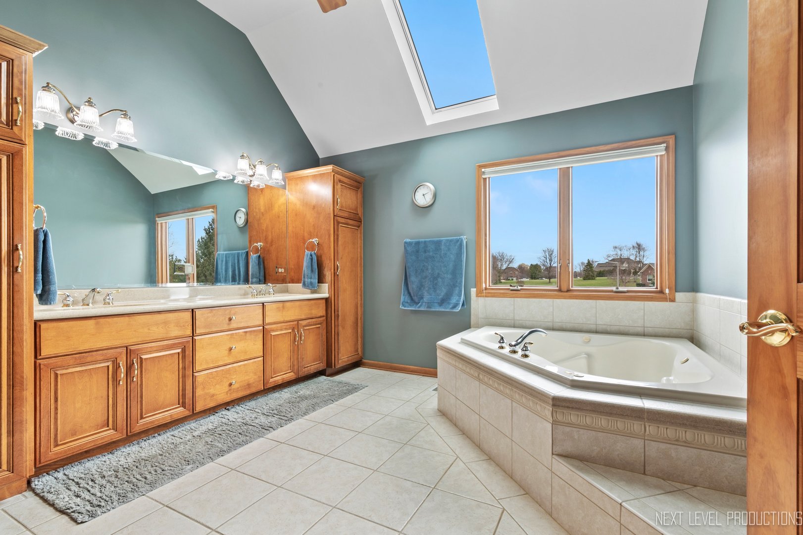 5370 Old Reserve Road Oswego, IL 60543 - Photo 31 of 48 a bathroom with a bathtub a sink a mirror and a shower
