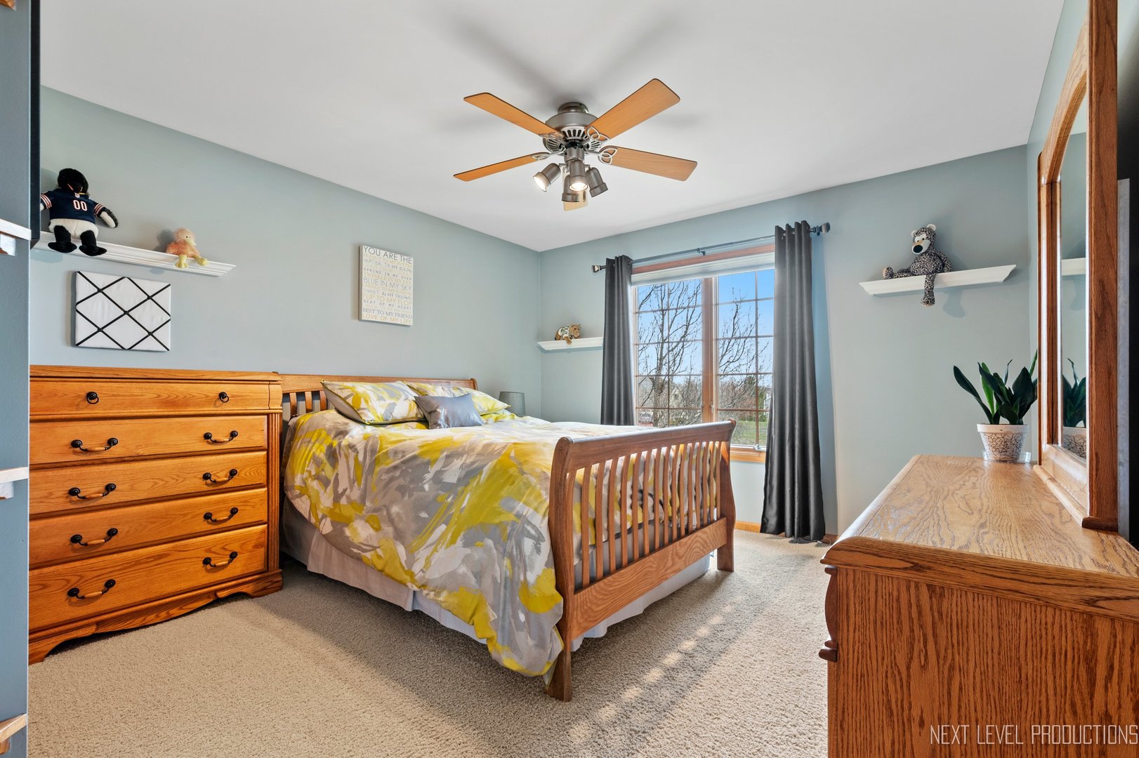 5370 Old Reserve Road Oswego, IL 60543 - Photo 35 of 48 a bedroom with a bed and a chandelier