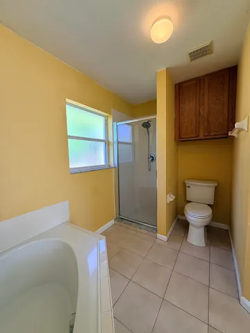 a bathroom with a toilet sink and shower