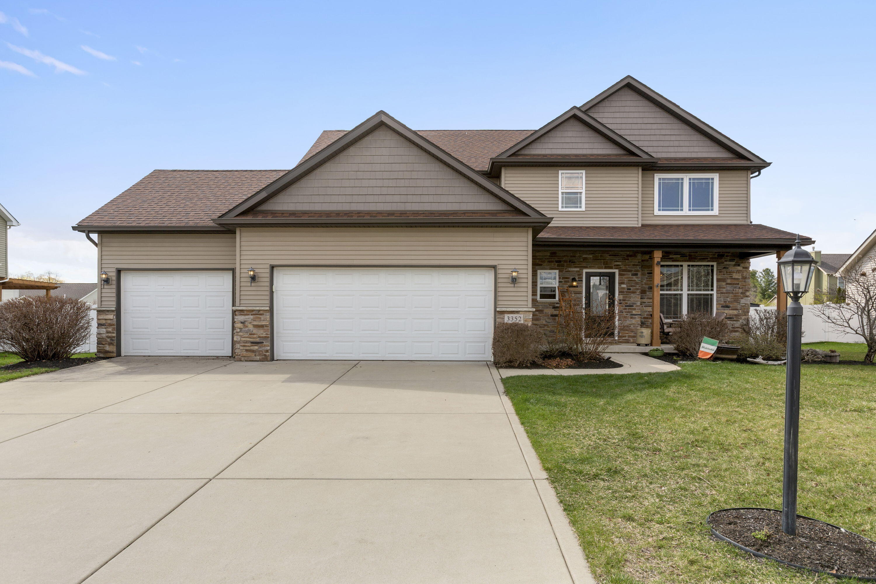 3352 Field Hawk Drive Valparaiso, IN 46383 - Photo 1 of 17 a front view of a house with a garden and porch