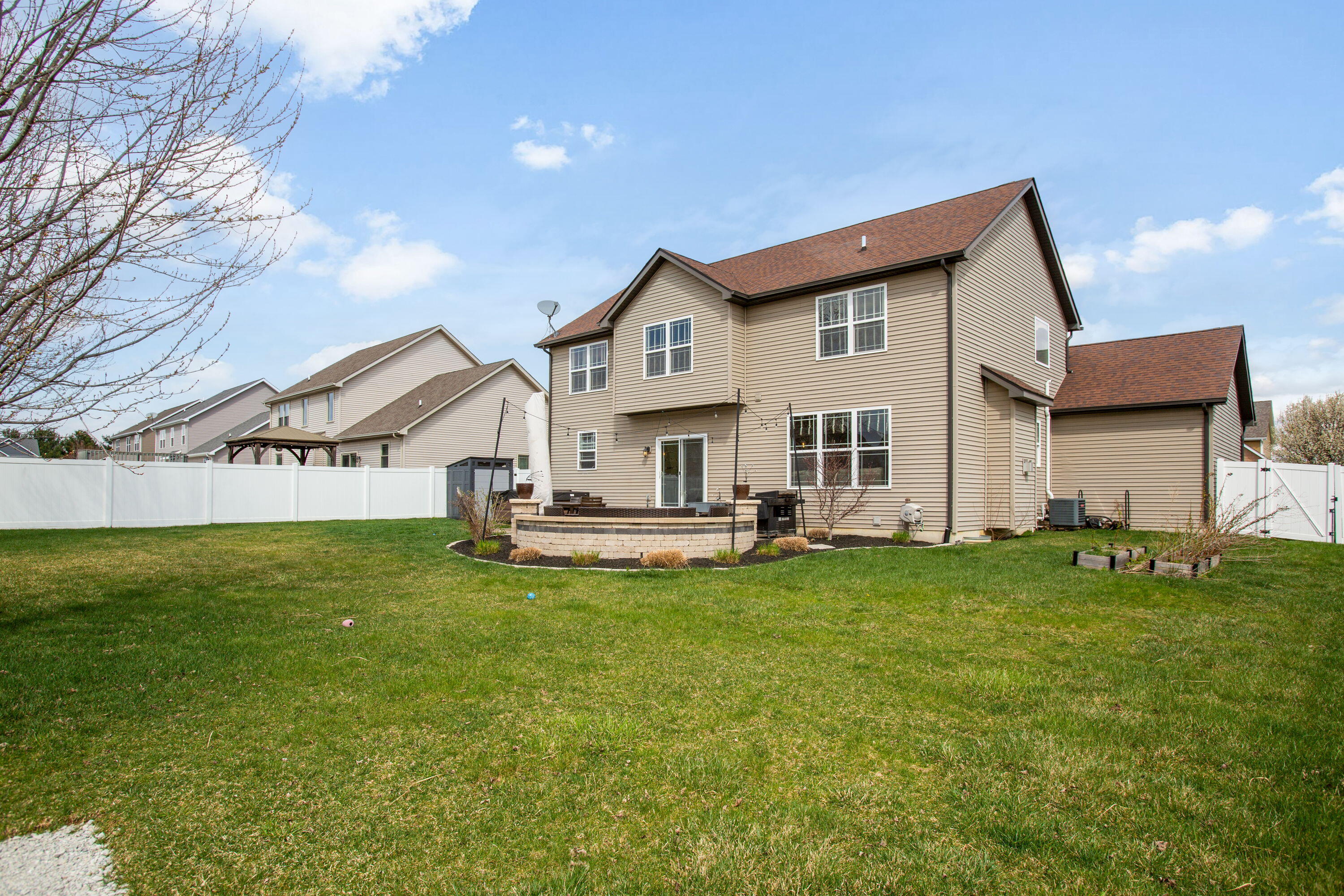 3352 Field Hawk Drive Valparaiso, IN 46383 - Photo 17 of 17 a view of a house with a yard and sitting area