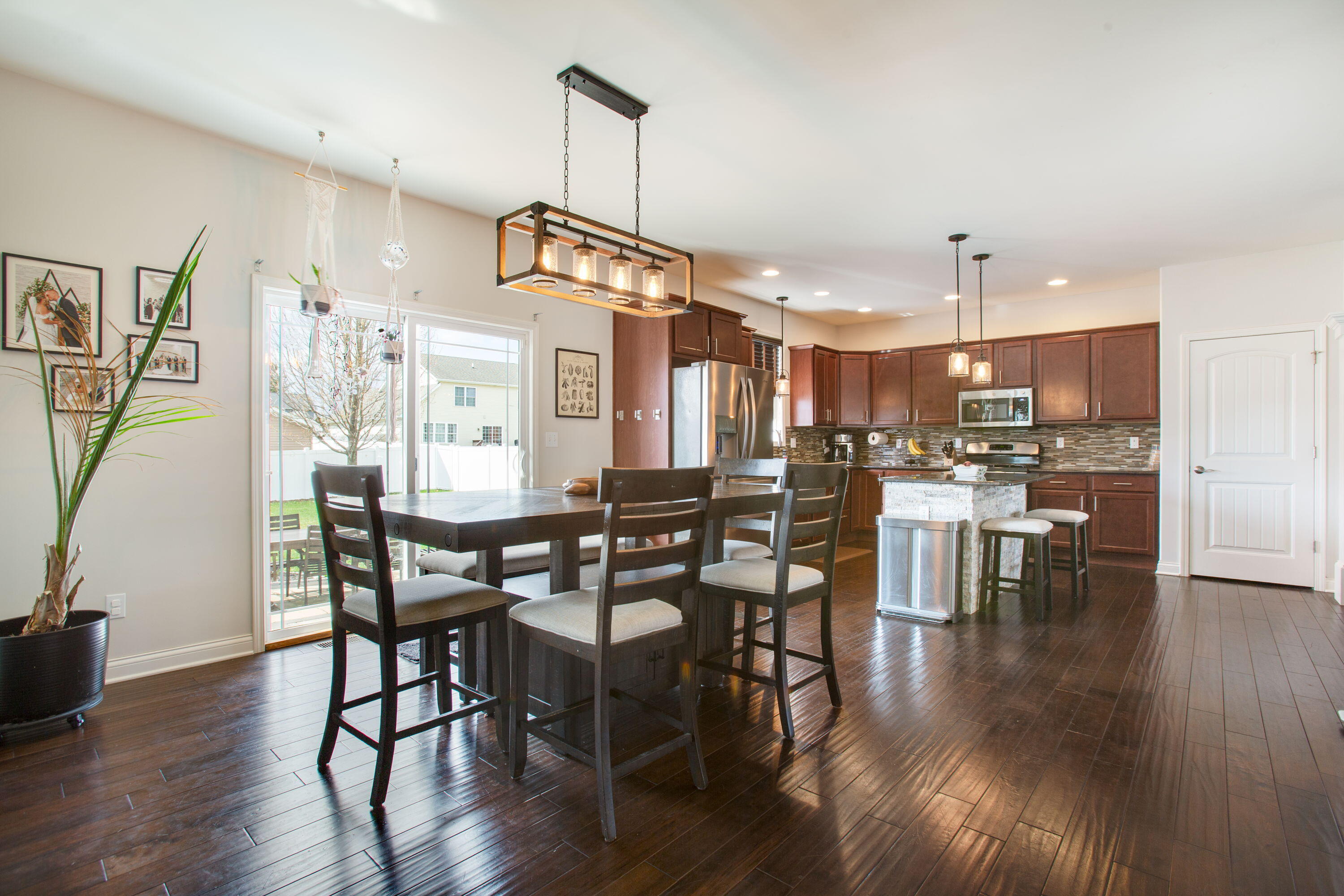 3352 Field Hawk Drive Valparaiso, IN 46383 - Photo 5 of 17 a view of a dining area with furniture window and wooden floor