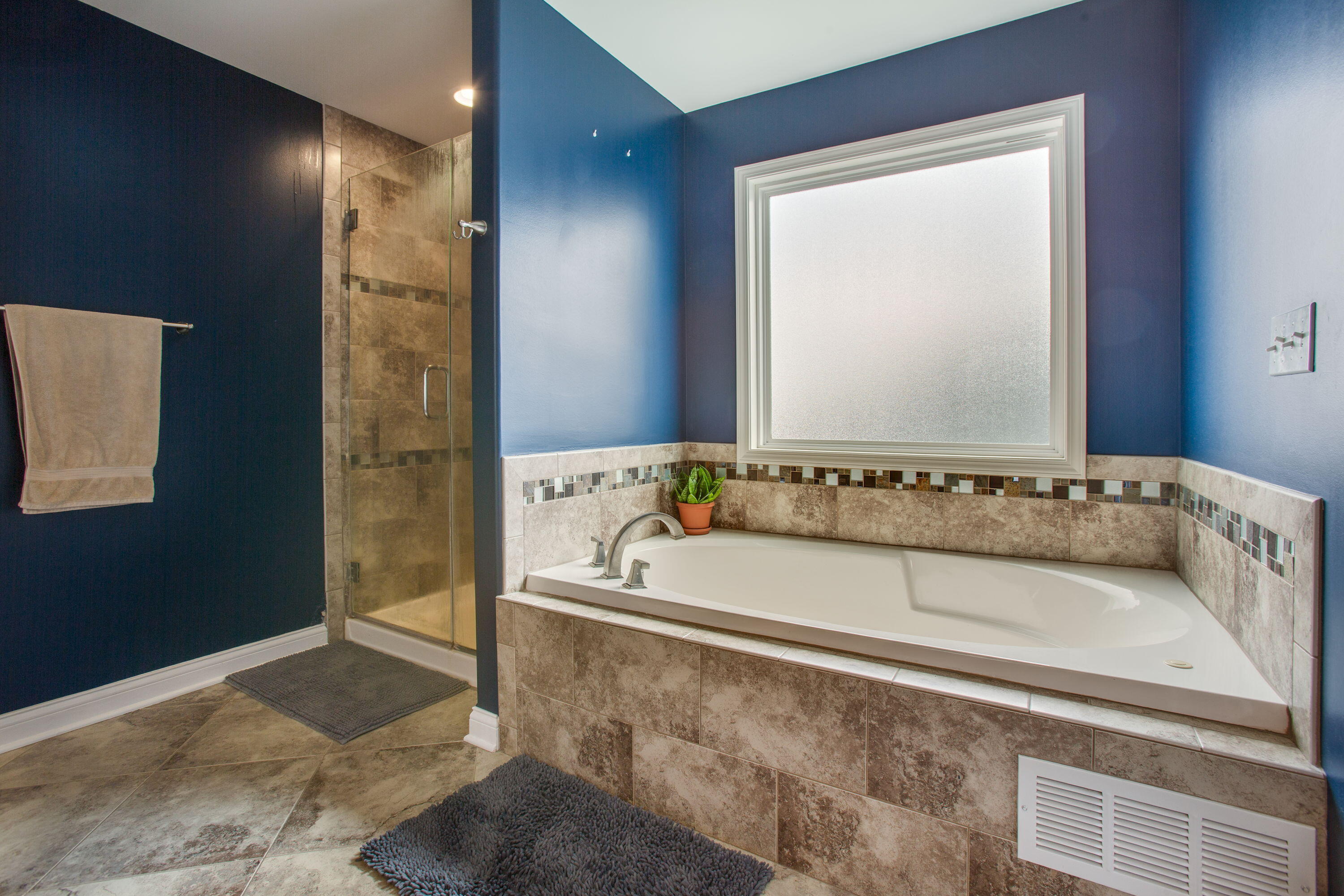 3352 Field Hawk Drive Valparaiso, IN 46383 - Photo 9 of 17 a bathroom with a bathtub and a sink