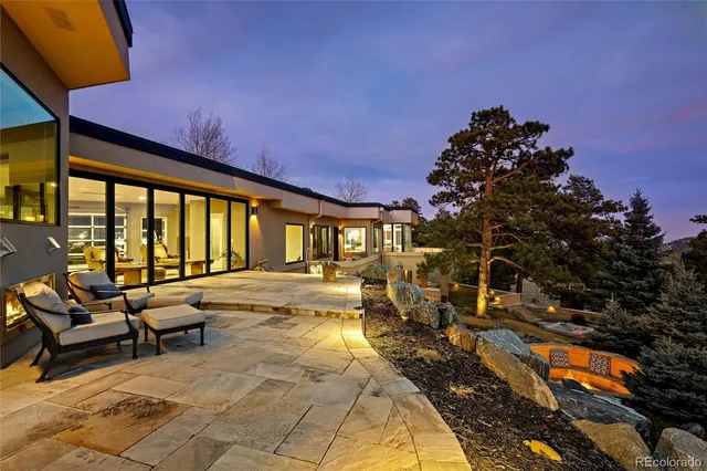 a view of a swimming pool with outdoor seating