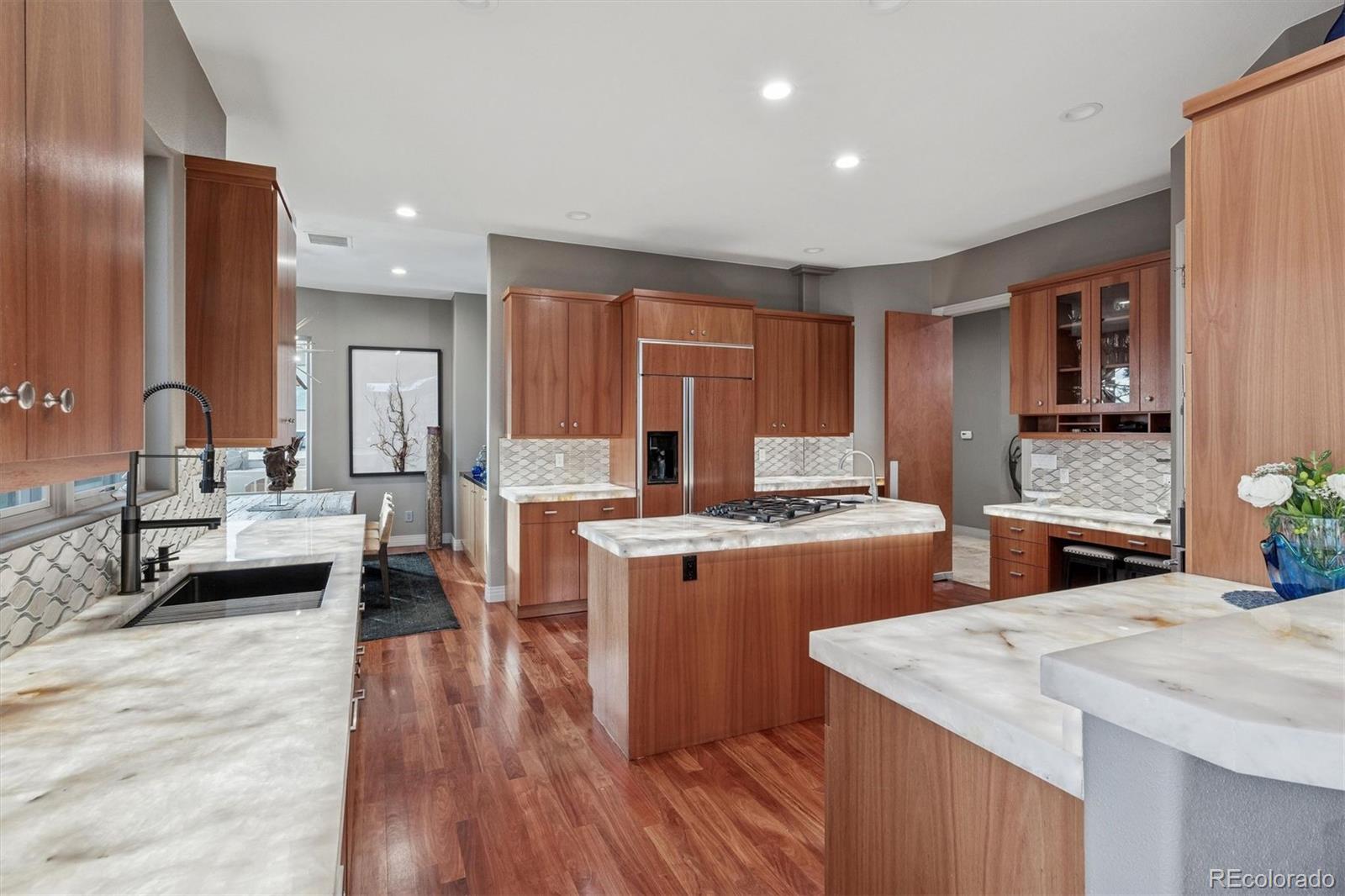 23534 Waynes Way Golden, CO 80401 - Photo 13 of 50 a kitchen with cabinets a counter top space a sink and a stove