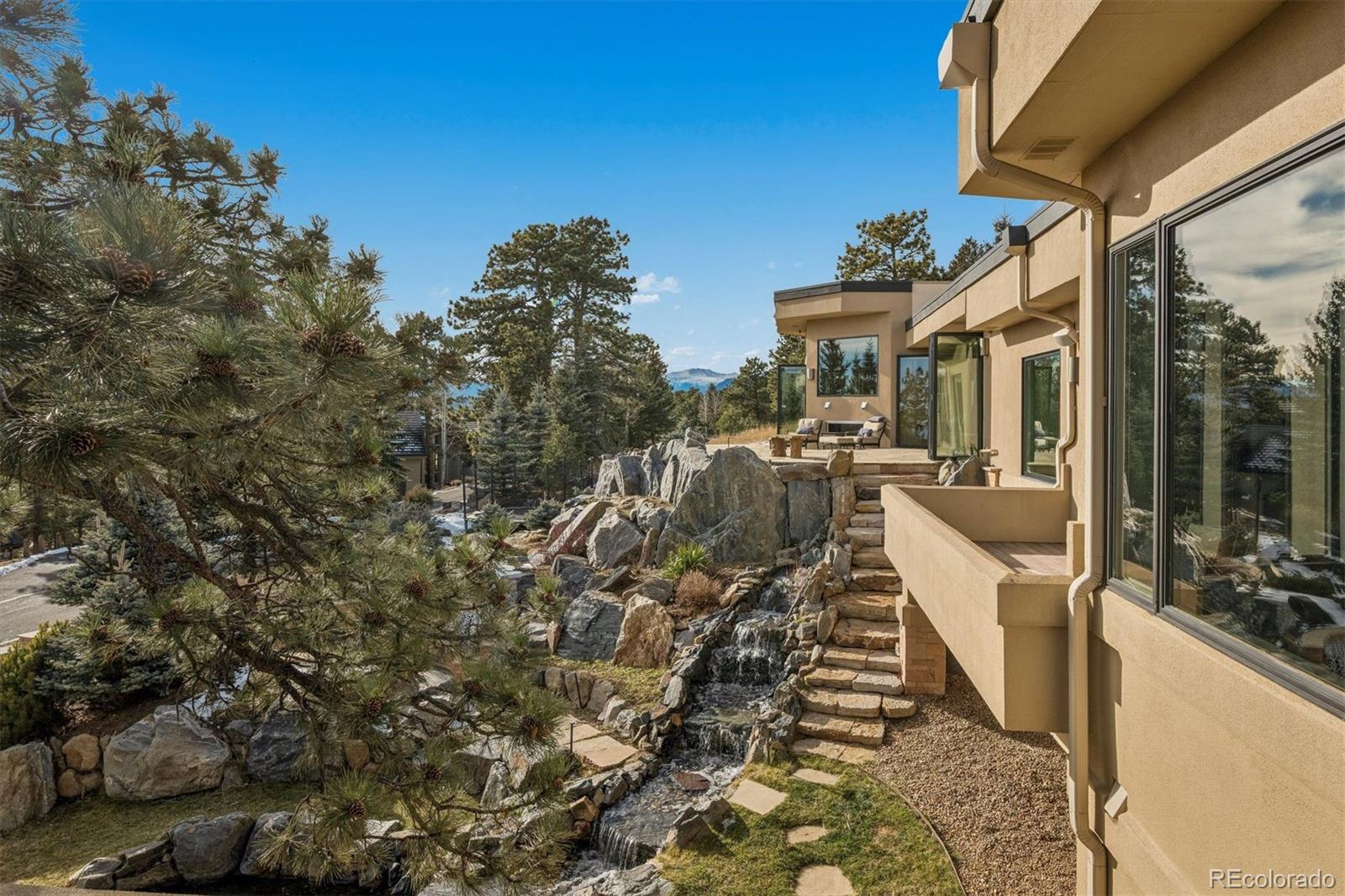 23534 Waynes Way Golden, CO 80401 - Photo 20 of 50 a view of a house with backyard porch and sitting area