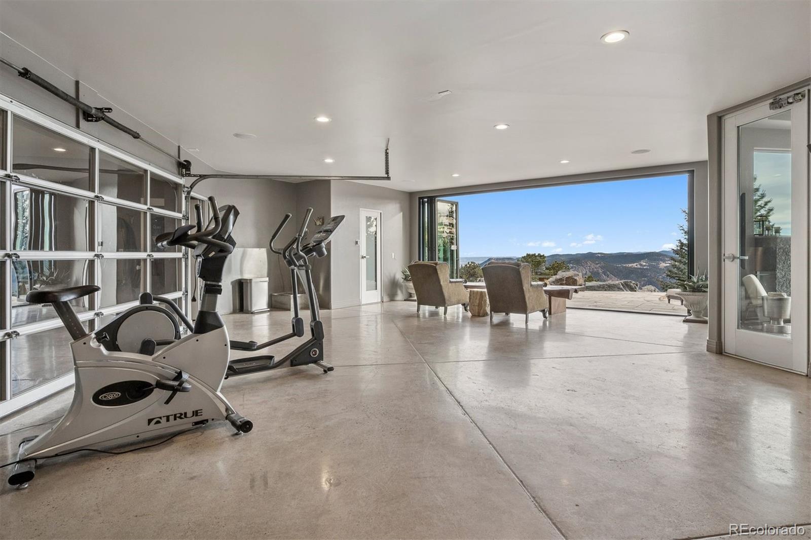 23534 Waynes Way Golden, CO 80401 - Photo 29 of 50 a view of a gym room with gym equipment