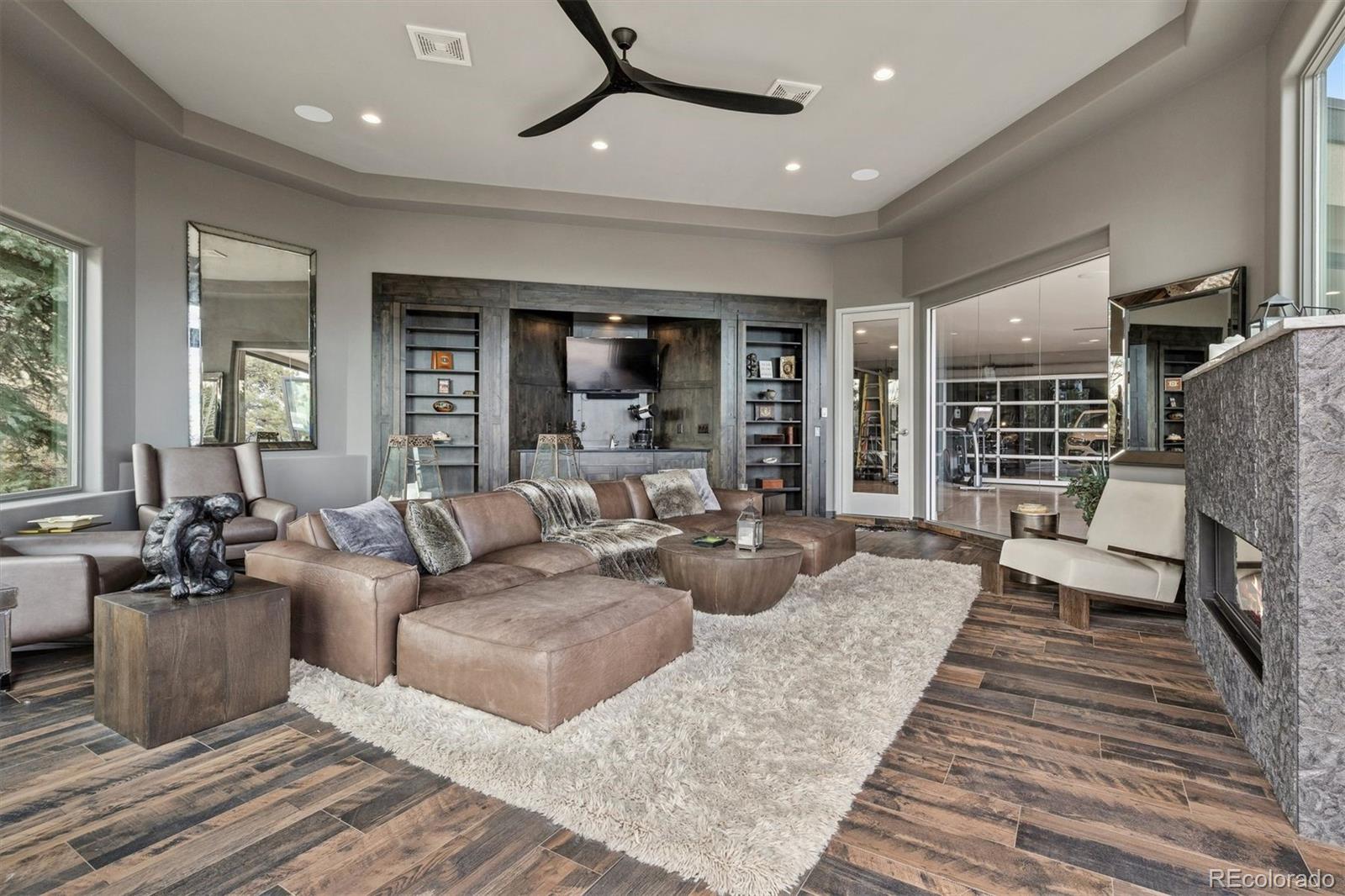 23534 Waynes Way Golden, CO 80401 - Photo 32 of 50 a living room with furniture and a fireplace
