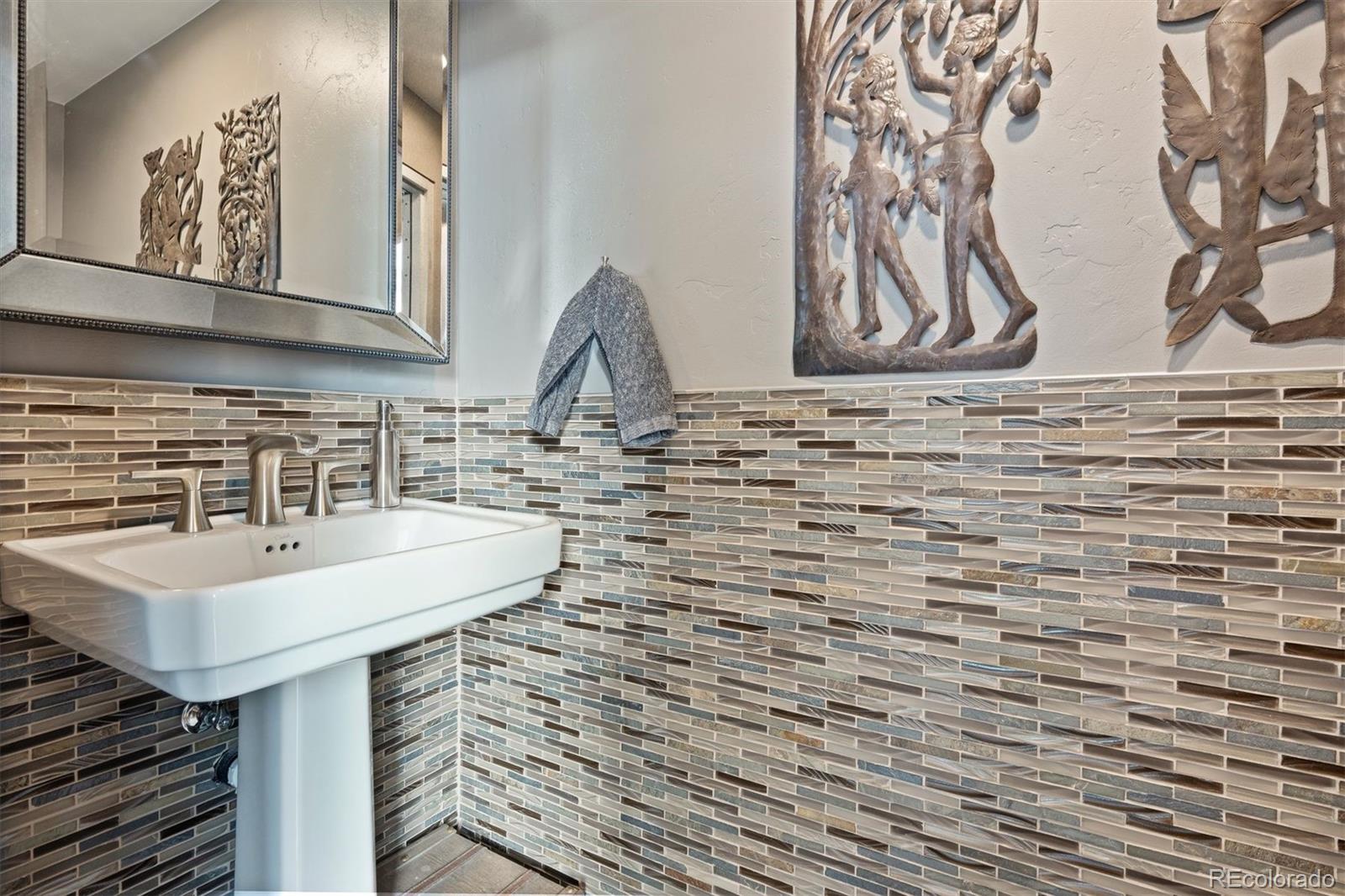 23534 Waynes Way Golden, CO 80401 - Photo 33 of 50 a bathroom with a sink and a mirror