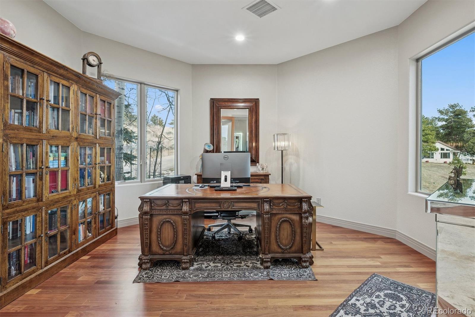 23534 Waynes Way Golden, CO 80401 - Photo 36 of 50 a room with furniture and a book shelf