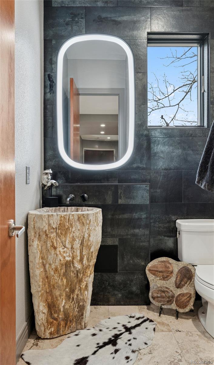 23534 Waynes Way Golden, CO 80401 - Photo 37 of 50 a bathroom with a toilet and a sink