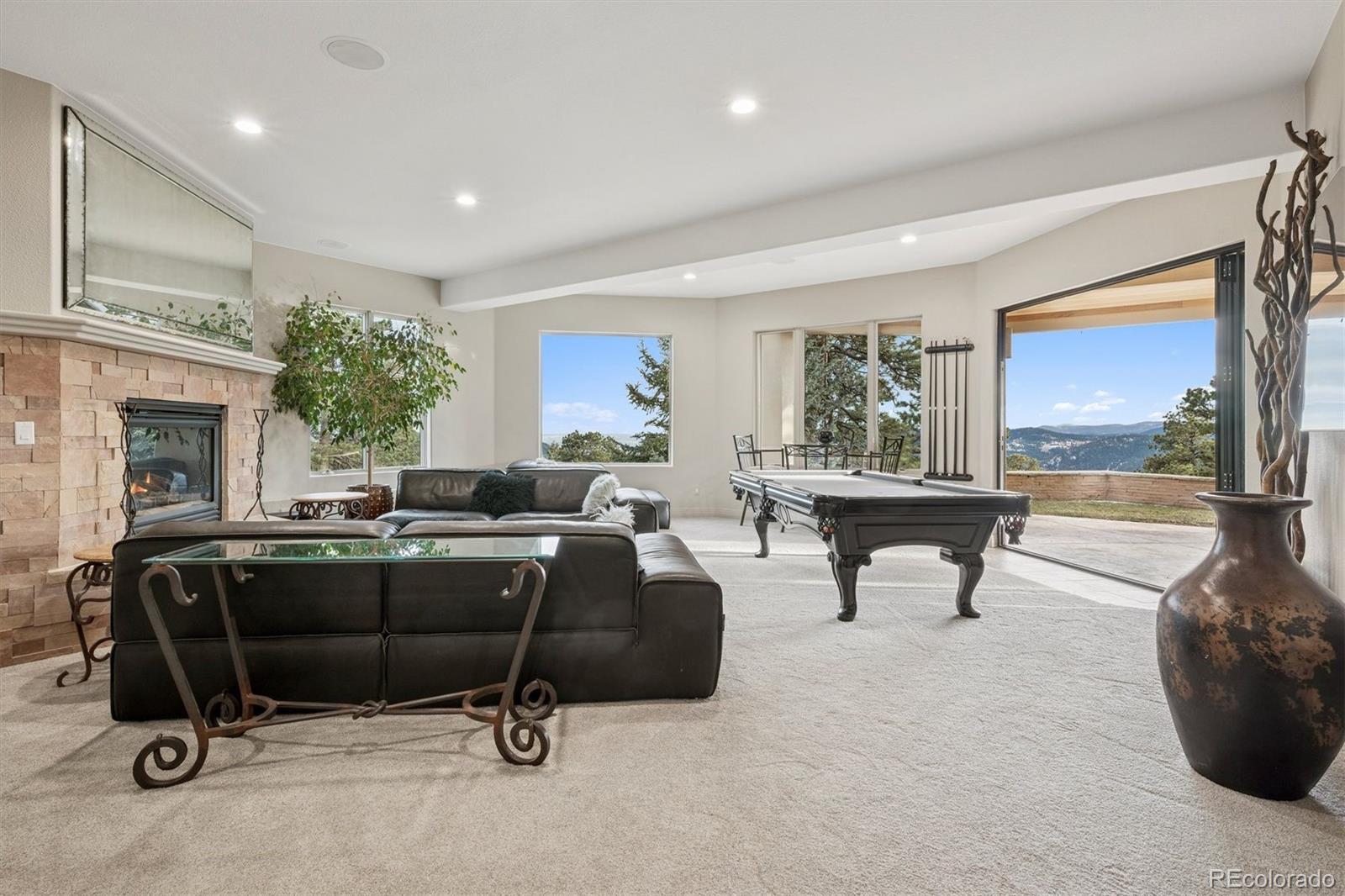 23534 Waynes Way Golden, CO 80401 - Photo 41 of 50 a living room with furniture a window and a flat screen tv
