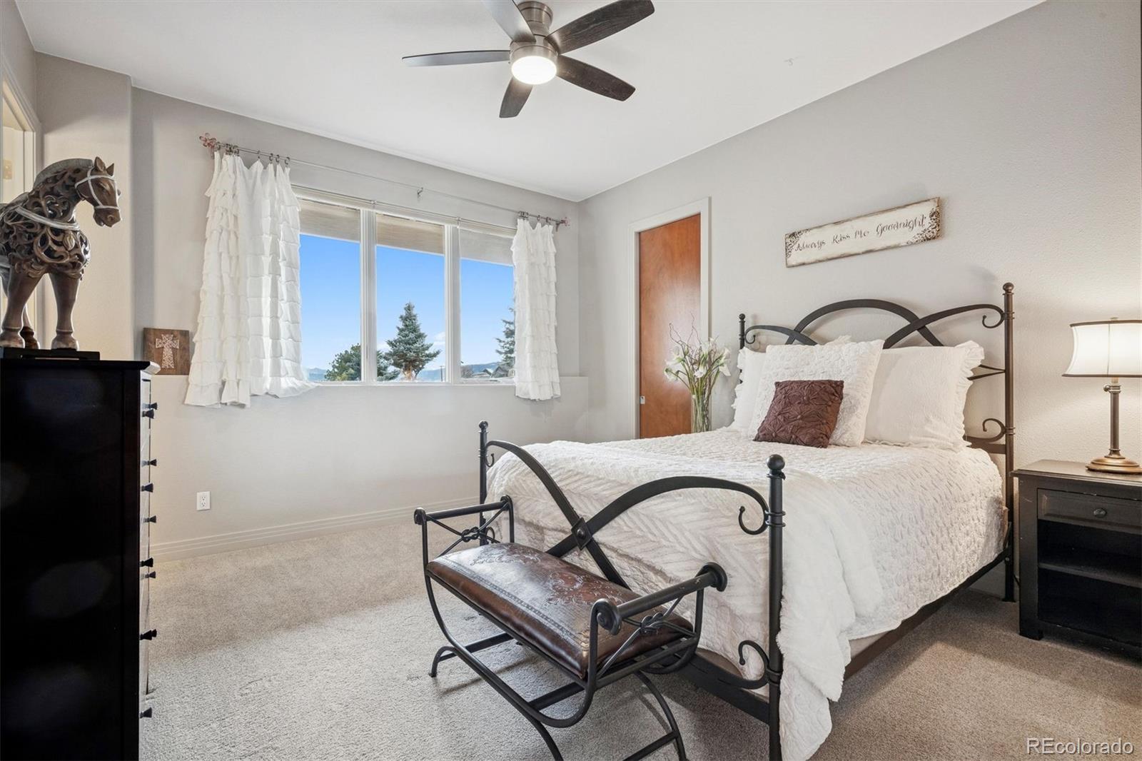 23534 Waynes Way Golden, CO 80401 - Photo 48 of 50 a bedroom with a bed and a dresser with the potted plant