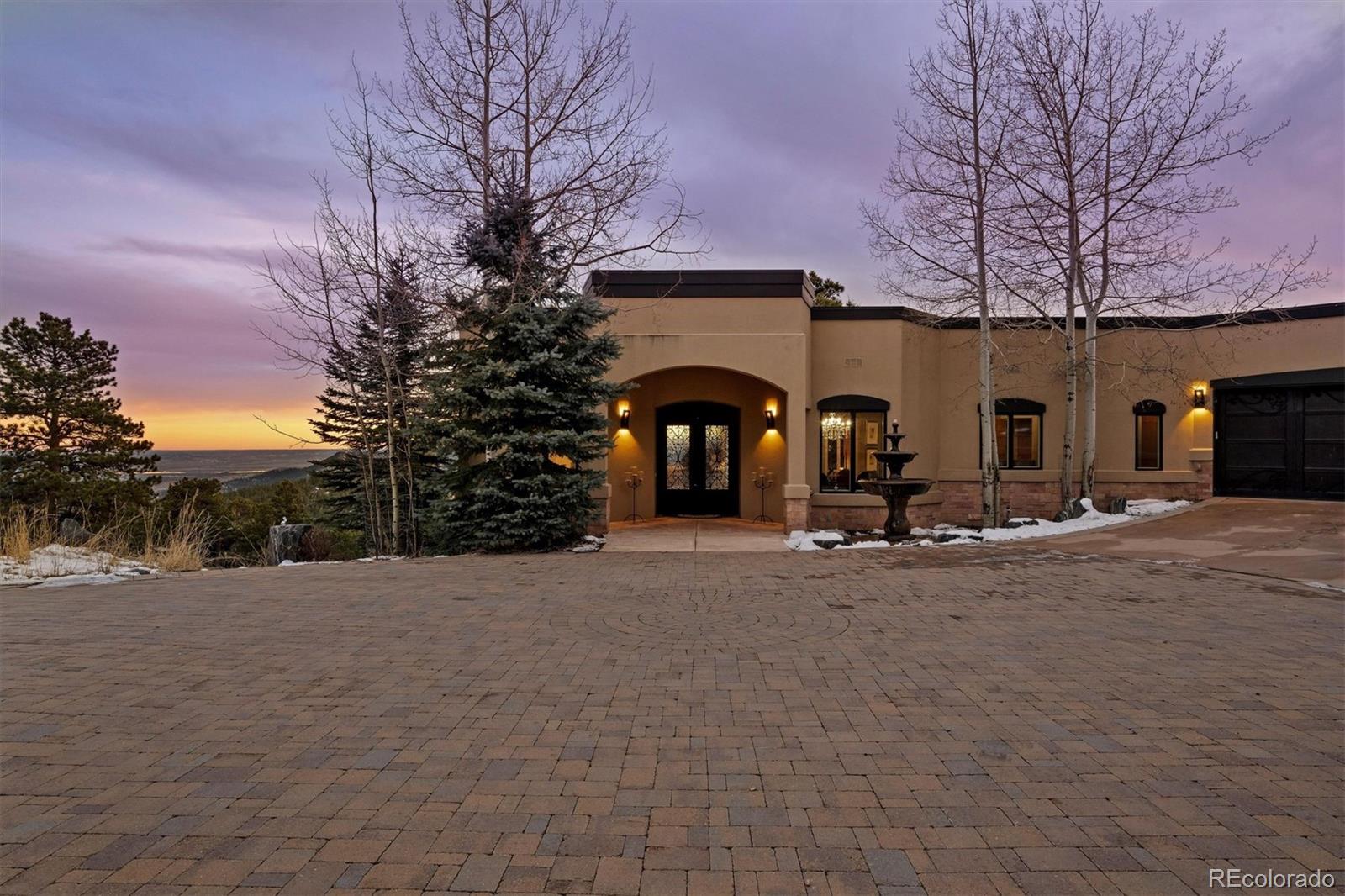 23534 Waynes Way Golden, CO 80401 - Photo 7 of 50 a view of a house with snow on the road