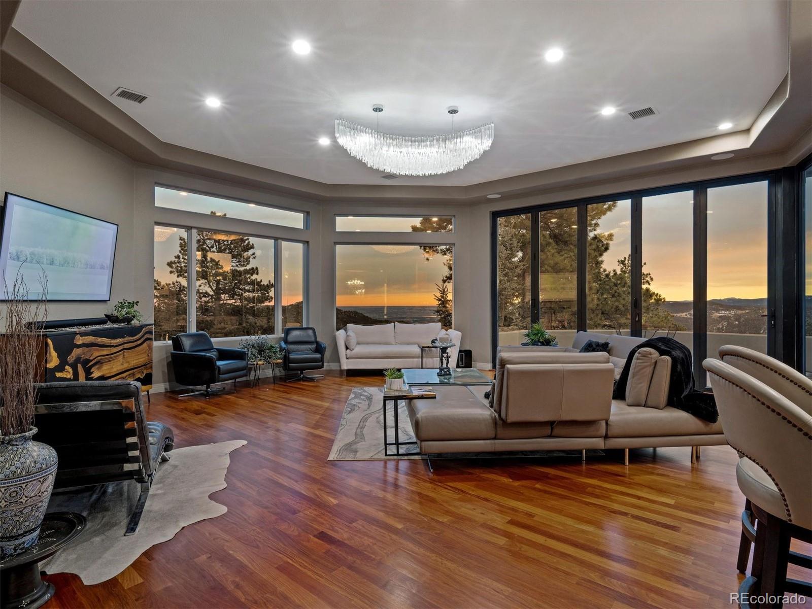 23534 Waynes Way Golden, CO 80401 - Photo 10 of 50 a living room with furniture and a flat screen tv