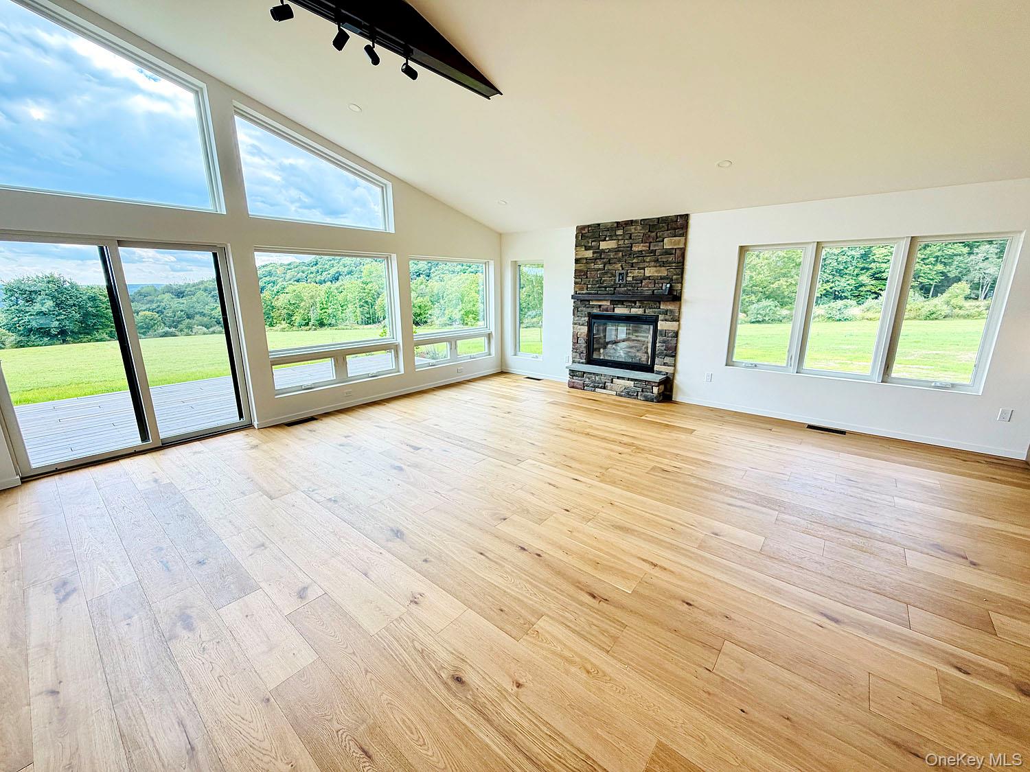 199 Henderson Road Hankins, NY 12741 - Photo 9 of 28 So much light from a wall of windows! High ceilings, fireplace