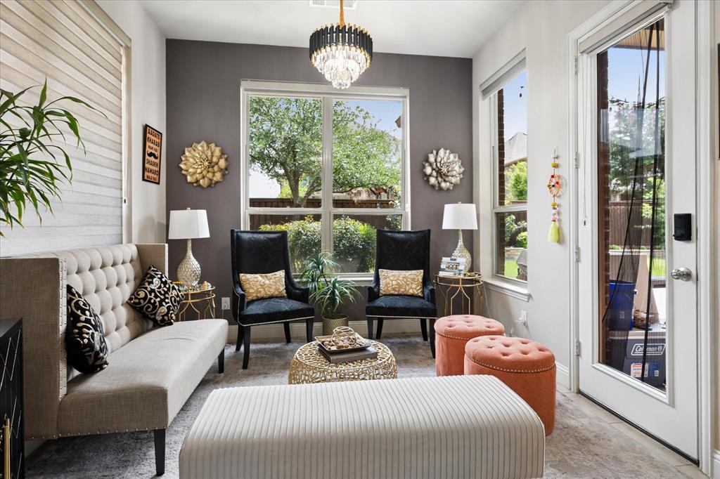 8268 Kara Creek Road Frisco, TX 75036 - Photo 11 of 31 Sunlit room featuring a chandelier and multiple windows