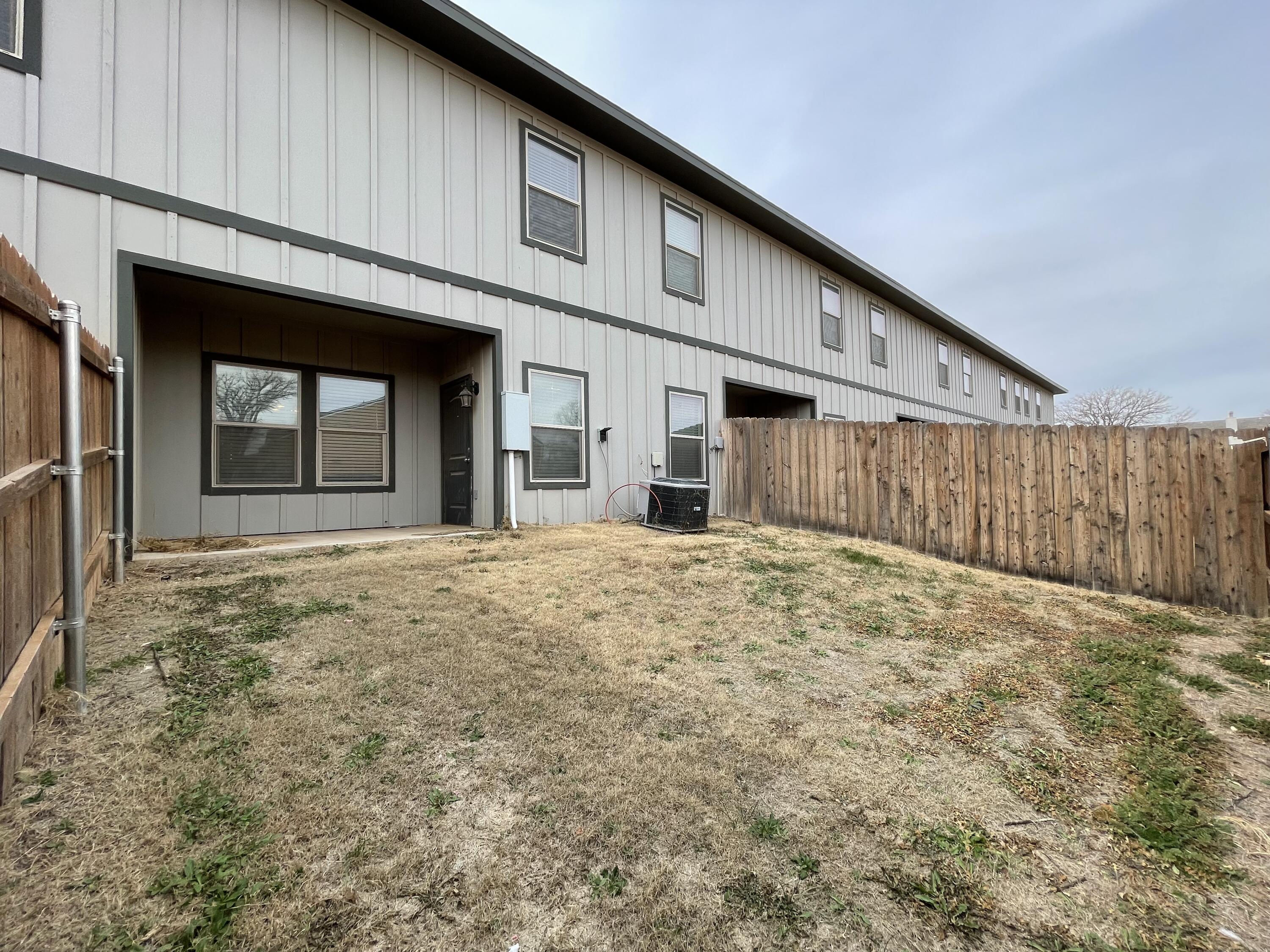 6040 24th Street, Unit 39 Lubbock, TX 79407 - Photo 13 of 13 a view of a backyard