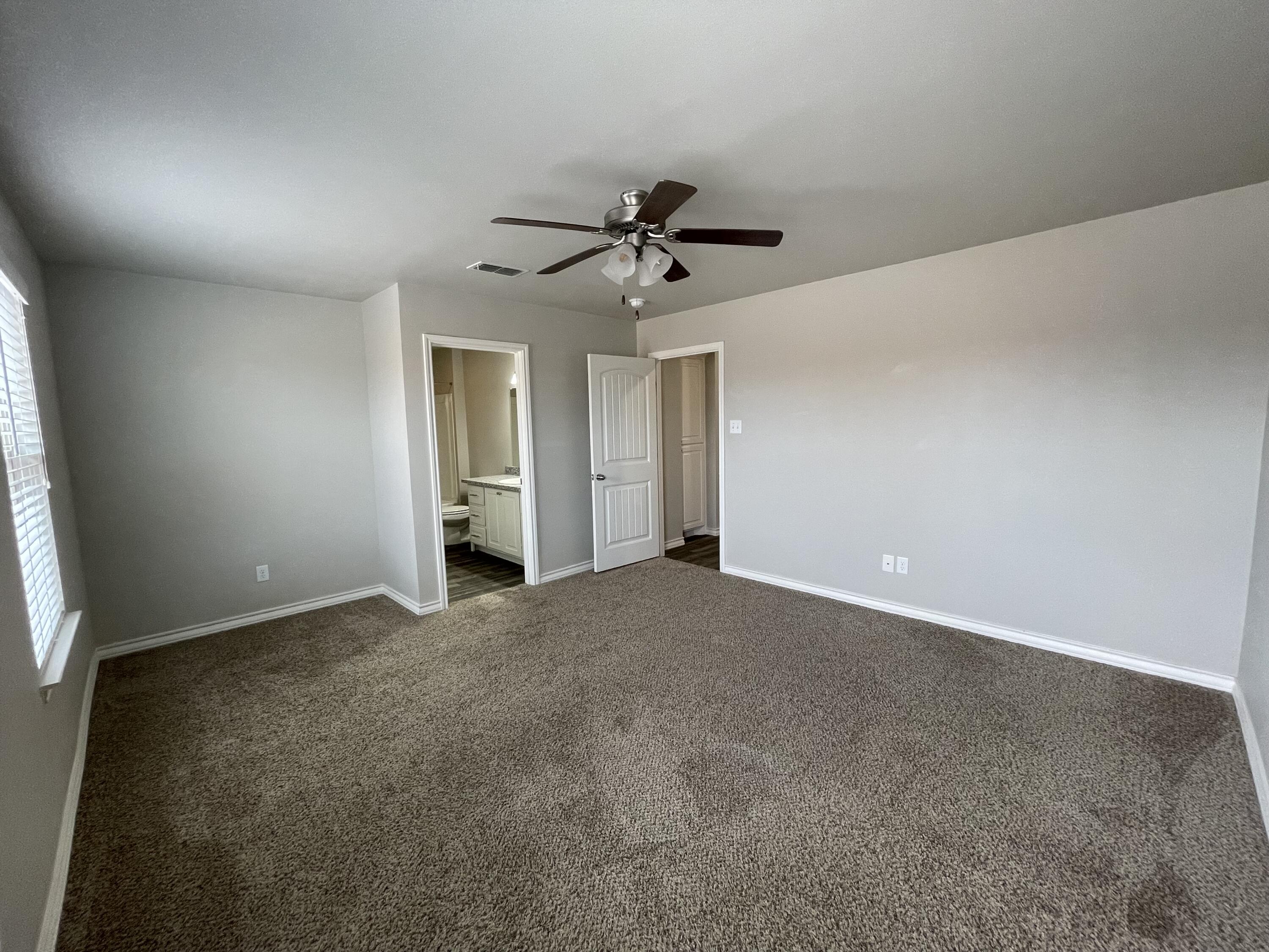 6040 24th Street, Unit 39 Lubbock, TX 79407 - Photo 7 of 13 a view of an empty room with a window