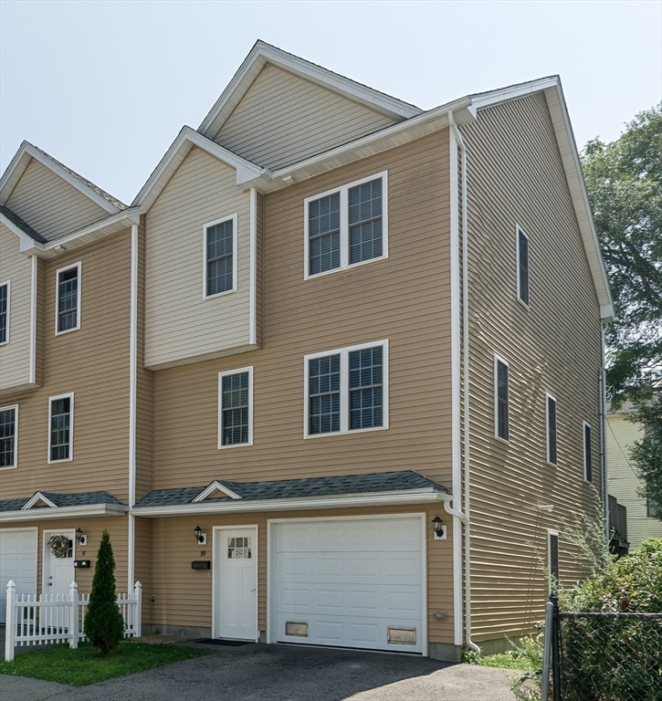 a front view of residential houses with stairs